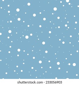 White falling snow on blue. Vector seamless background.