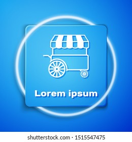 White Fast street food cart with awning icon isolated on blue background. Urban kiosk. Blue square button. Vector Illustration