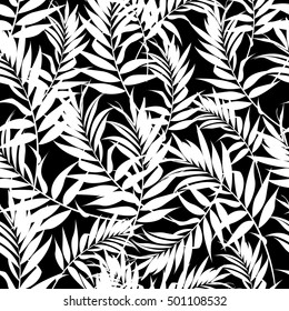 White fern leaves on a black background. Seamless pattern. Modern palm leaves.