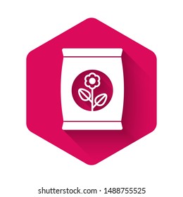 White Fertilizer bag icon isolated with long shadow. Pink hexagon button. Vector Illustration