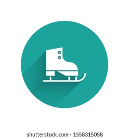 White Figure skates icon isolated with long shadow. Ice skate shoes icon. Sport boots with blades. Green circle button. Vector Illustration