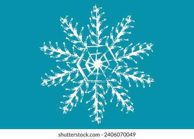 White figured snowflake on a turquoise background. The snowflake is white. Beautiful white snowflake on a colored background