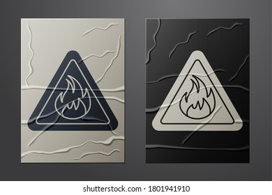 White Fire flame in triangle icon isolated on crumpled paper background. Warning sign of flammable product. Paper art style. Vector Illustration