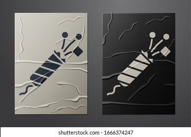 White Firework rocket icon isolated on crumpled paper background. Concept of fun party. Explosive pyrotechnic symbol. Paper art style. Vector Illustration