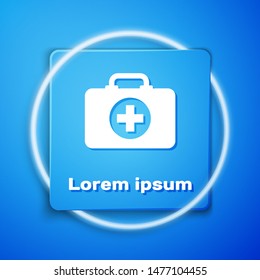 White First aid kit icon isolated on blue background. Medical box with cross. Medical equipment for emergency. Healthcare concept. Blue square button. Vector Illustration