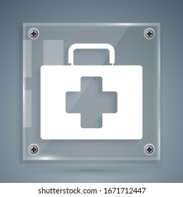 White First aid kit icon isolated on grey background. Medical box with cross. Medical equipment for emergency. Healthcare concept. Square glass panels. Vector Illustration