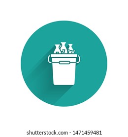 White Fishing bucket with fishes icon isolated with long shadow. Fish in a bucket. Green circle button. Vector Illustration