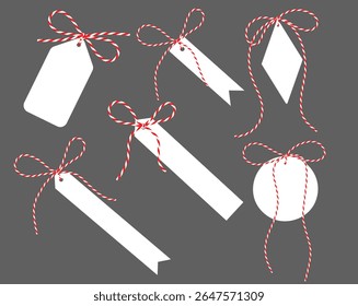 White flat Gift Tag with Ribbon Bow Isolated on grey Background. Blank Christmas New Year label for present tied up with cotton red rope bakers twine. Vector Labels for Holiday and Packaging Design