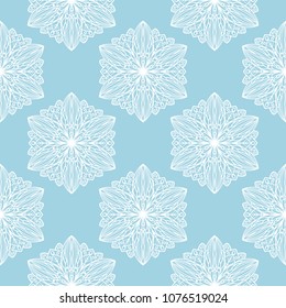 White floral design on blue background. Seamless pattern for textile and wallpapers