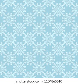 White floral design on blue background. Seamless ornament for textile and wallpapers