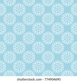 White floral design on blue background. Seamless ornament for textile and wallpapers