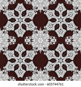 White floral ornament in baroque style. Damask seamless pattern repeating background. White element on brown background. Antique white repeatable wallpaper.