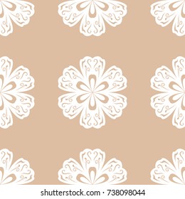 White floral ornament on beige background. Seamless pattern for textile and wallpapers