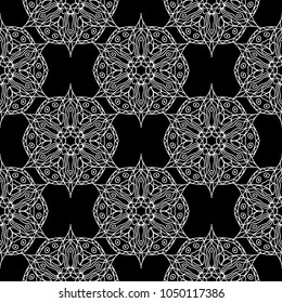 White floral ornament on black background. Seamless pattern for textile and wallpapers