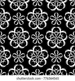 White floral ornament on black background. Seamless pattern for textile and wallpapers