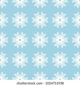 White floral ornament on blue background. Seamless pattern for textile and wallpapers