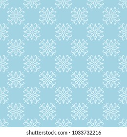 White floral ornament on blue background. Seamless pattern for textile and wallpapers