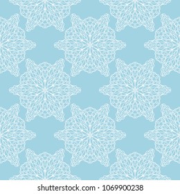 White floral ornament on blue background. Seamless pattern for textile and wallpapers