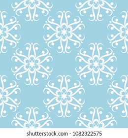 White floral ornament on blue background. Seamless pattern for textile and wallpapers