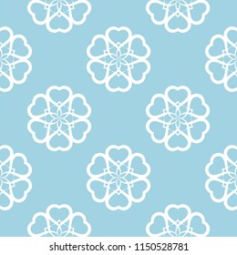 White floral ornament on blue background. Seamless pattern for textile and wallpapers