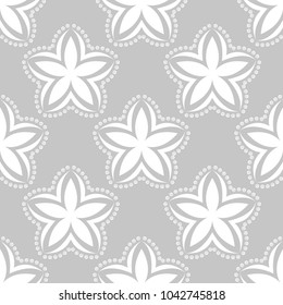 White floral ornament on gray background. Seamless pattern for textile and wallpapers