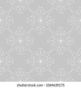 White floral ornament on gray background. Seamless pattern for textile and wallpapers