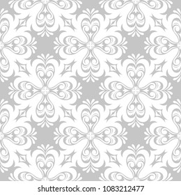 White floral ornament on gray background. Seamless pattern for textile and wallpapers