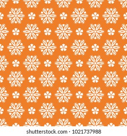 White floral ornament on orange background. Seamless pattern for textile and wallpapers
