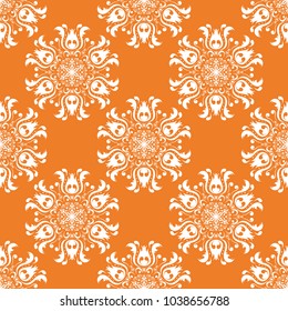 White floral ornament on orange background. Seamless pattern for textile and wallpapers