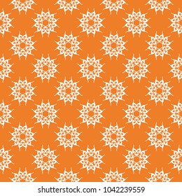 White floral ornament on orange background. Seamless pattern for textile and wallpapers