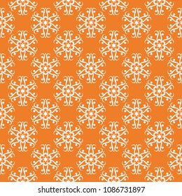 White floral ornament on orange background. Seamless pattern for textile and wallpapers