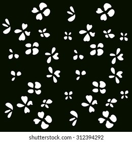 White floral pattern on a black background . Vector.