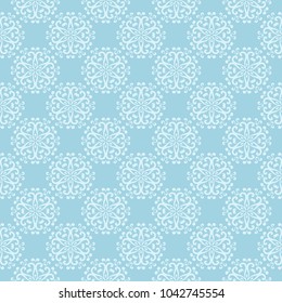 White floral pattern on blue background. Seamless ornament for textile and wallpapers