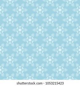 White floral pattern on blue background. Seamless ornament for textile and wallpapers