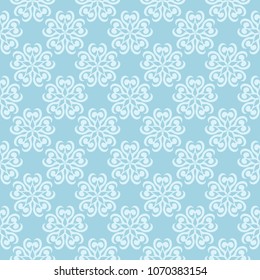 White floral pattern on blue background. Seamless ornament for textile and wallpapers