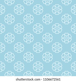 White floral pattern on blue background. Seamless ornament for textile and wallpapers