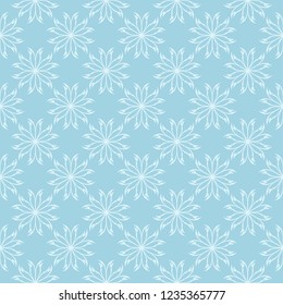White floral pattern on blue background. Seamless ornament for textile and wallpapers