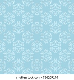 White floral pattern on blue background. Seamless ornament for textile and wallpapers