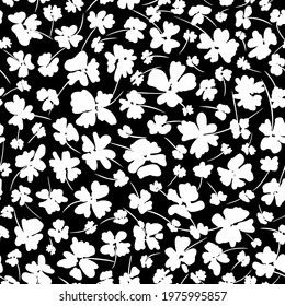 White flower silhouettes different sized seamless repeat pattern. Random placed botany vector elements all over surface print.