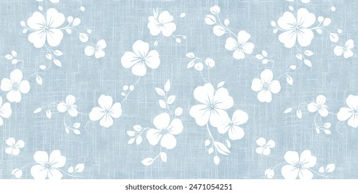 White flower stamp with soft blue fabric. Natural textile background. Fabric texture background. Textile background with a cotton fabric with a floral pattern.