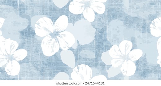 Weiße Blütenmarke mit weichem blauem Stoff. Natürlicher textiler Hintergrund. Texturhintergrund des Gewebes. Textiler Hintergrund mit einem Baumwollstoff mit einem floralen Muster.