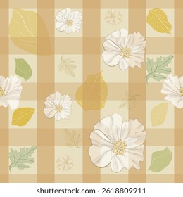 White flowers, green and golden yellow leaves on a brown and cream plaid background.