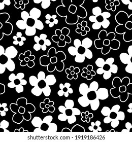 White flowers on a black background seamless pattern. Elegant floral texture. Great for printing, clothing. Vector illustration.