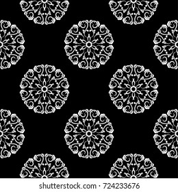 White flowers on black background. Ornamental seamless pattern for textile and wallpapers