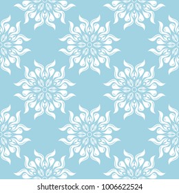 White flowers on blue background. Ornamental seamless pattern for textile and wallpapers