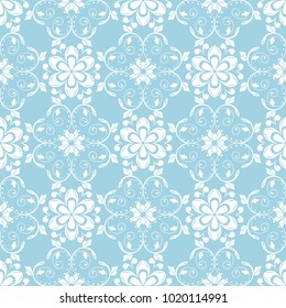 White flowers on blue background. Ornamental seamless pattern for textile and wallpapers