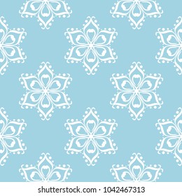 White flowers on blue background. Ornamental seamless pattern for textile and wallpapers