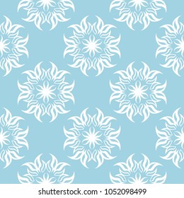 White flowers on blue background. Ornamental seamless pattern for textile and wallpapers