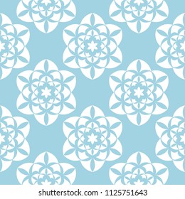 White flowers on blue background. Ornamental seamless pattern for textile and wallpapers