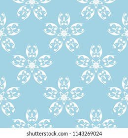 White flowers on blue background. Ornamental seamless pattern for textile and wallpapers
